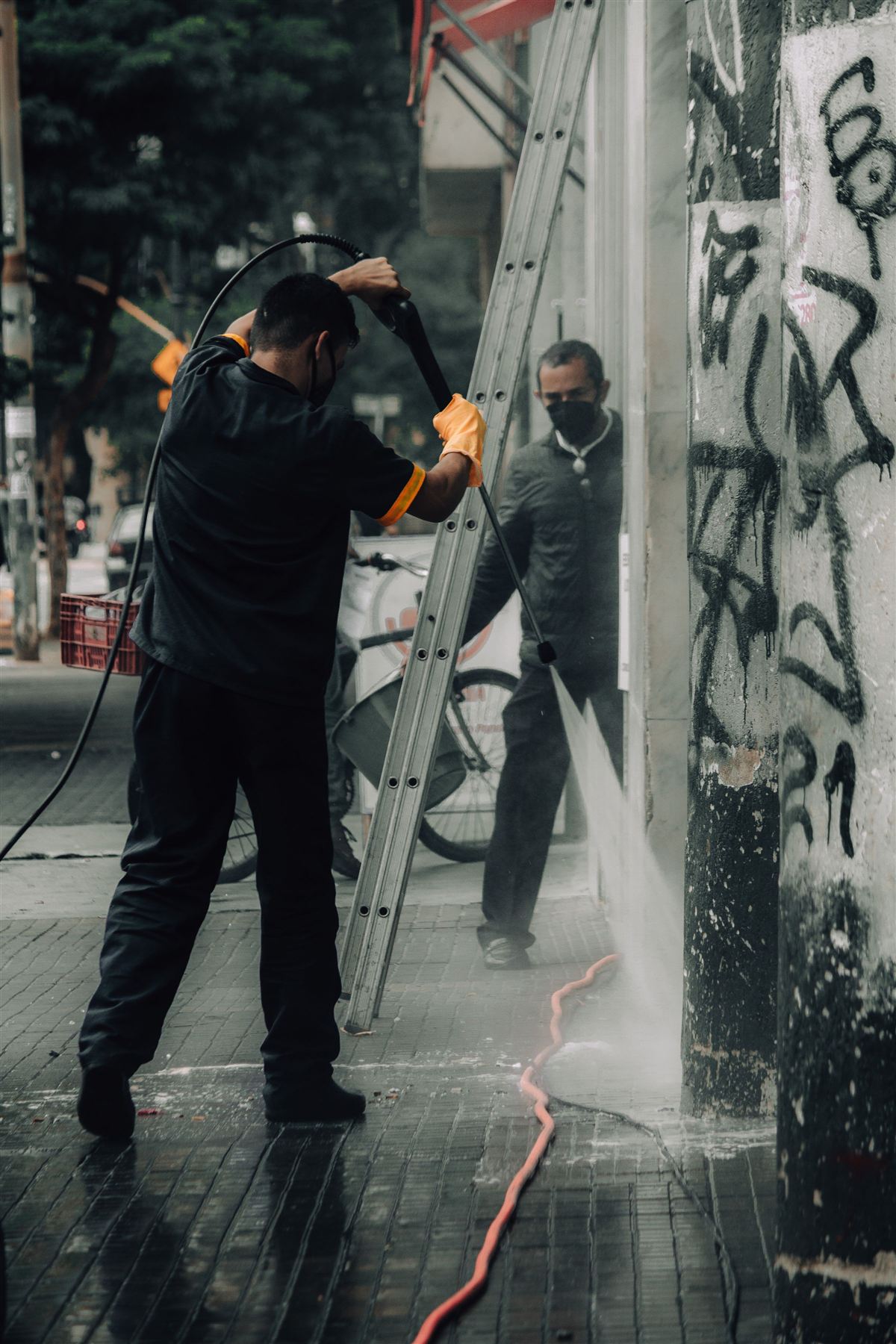 Building facade pressure wash cleaning in progress — representative finish example