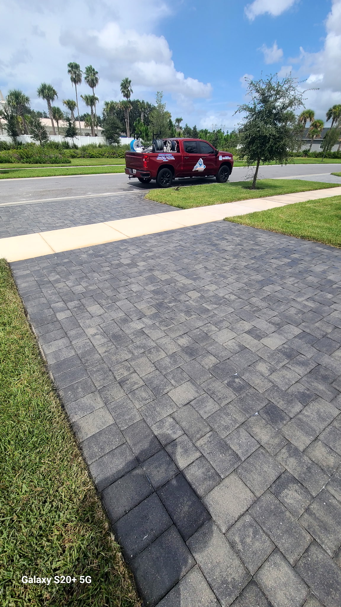 JB Powerwash truck on a paver driveway job site