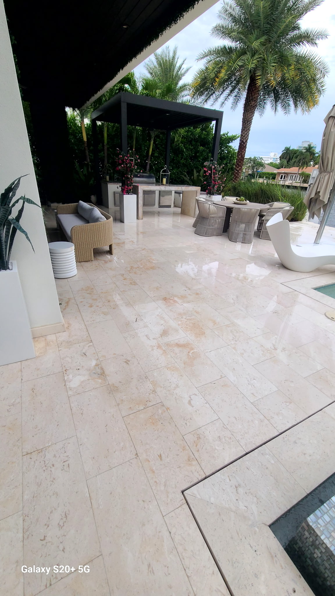 Travertine paver patio and outdoor kitchen cleaned by JB Powerwash