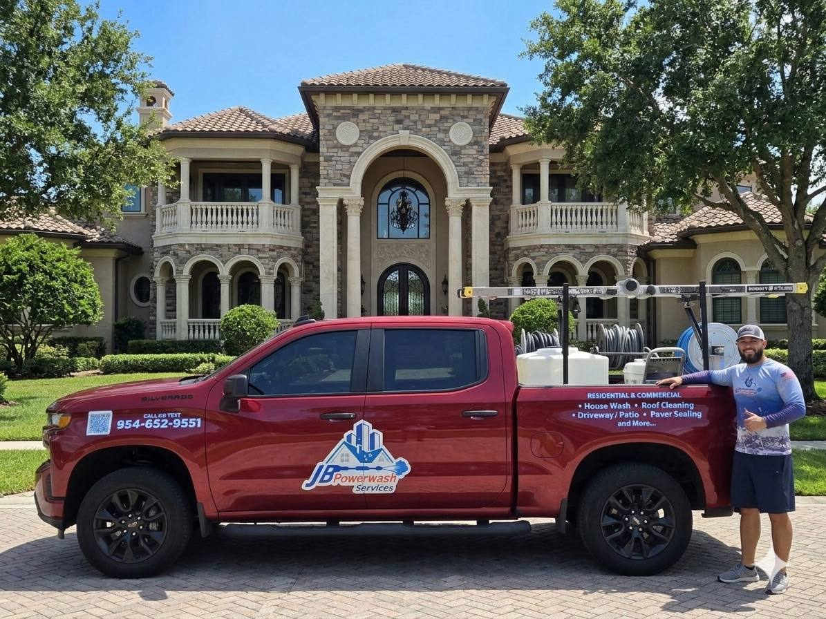 Juan, owner of JB Powerwash Services, with the company truck