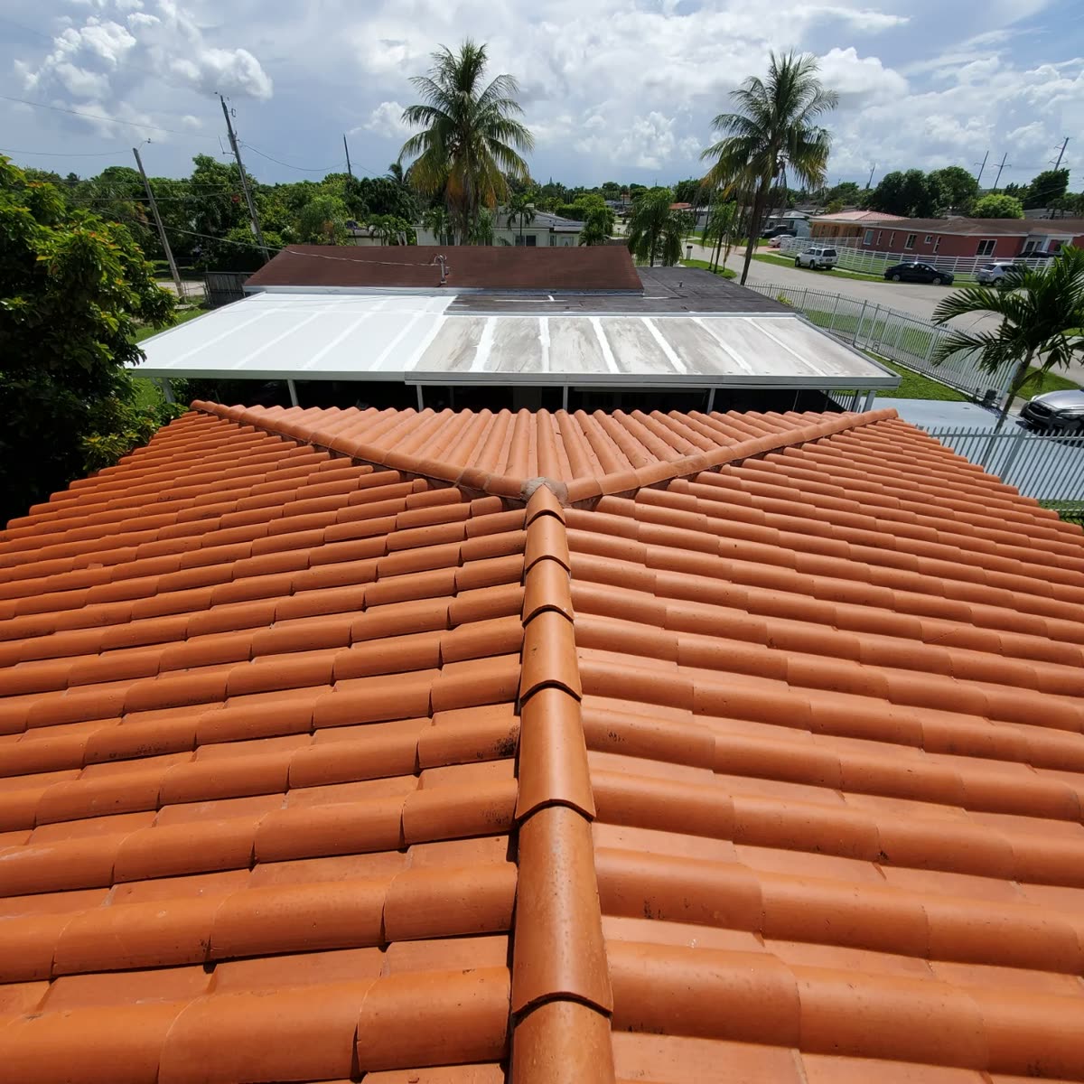 Barrel tile roof in Port St. Lucie after a JB Powerwash soft wash — restored to its original color