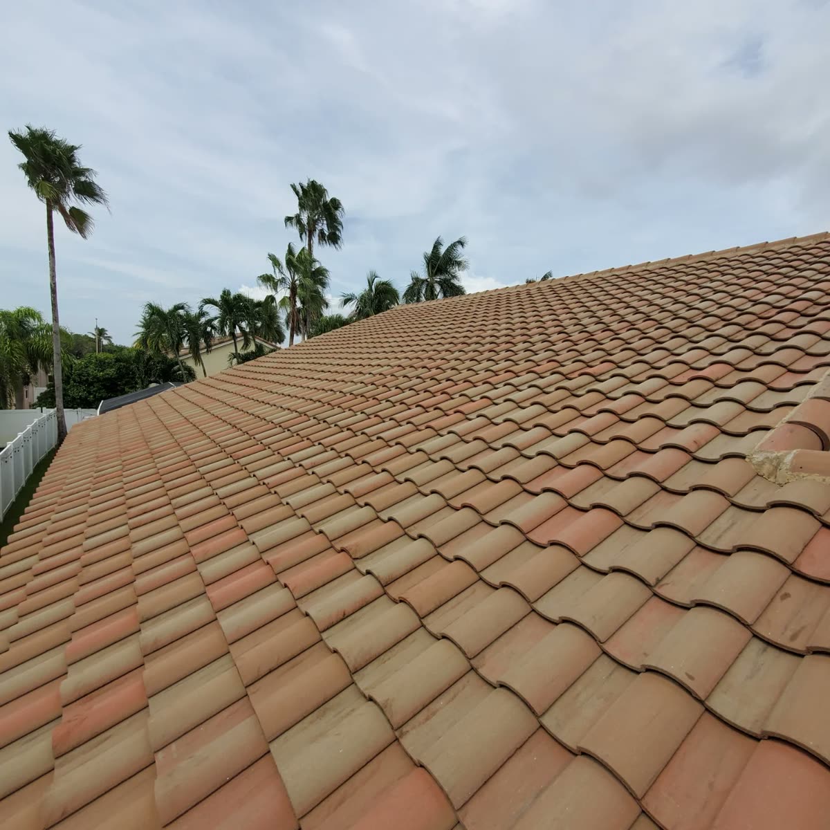 Barrel tile roof cleaned by JB Powerwash — even color restored across the whole slope